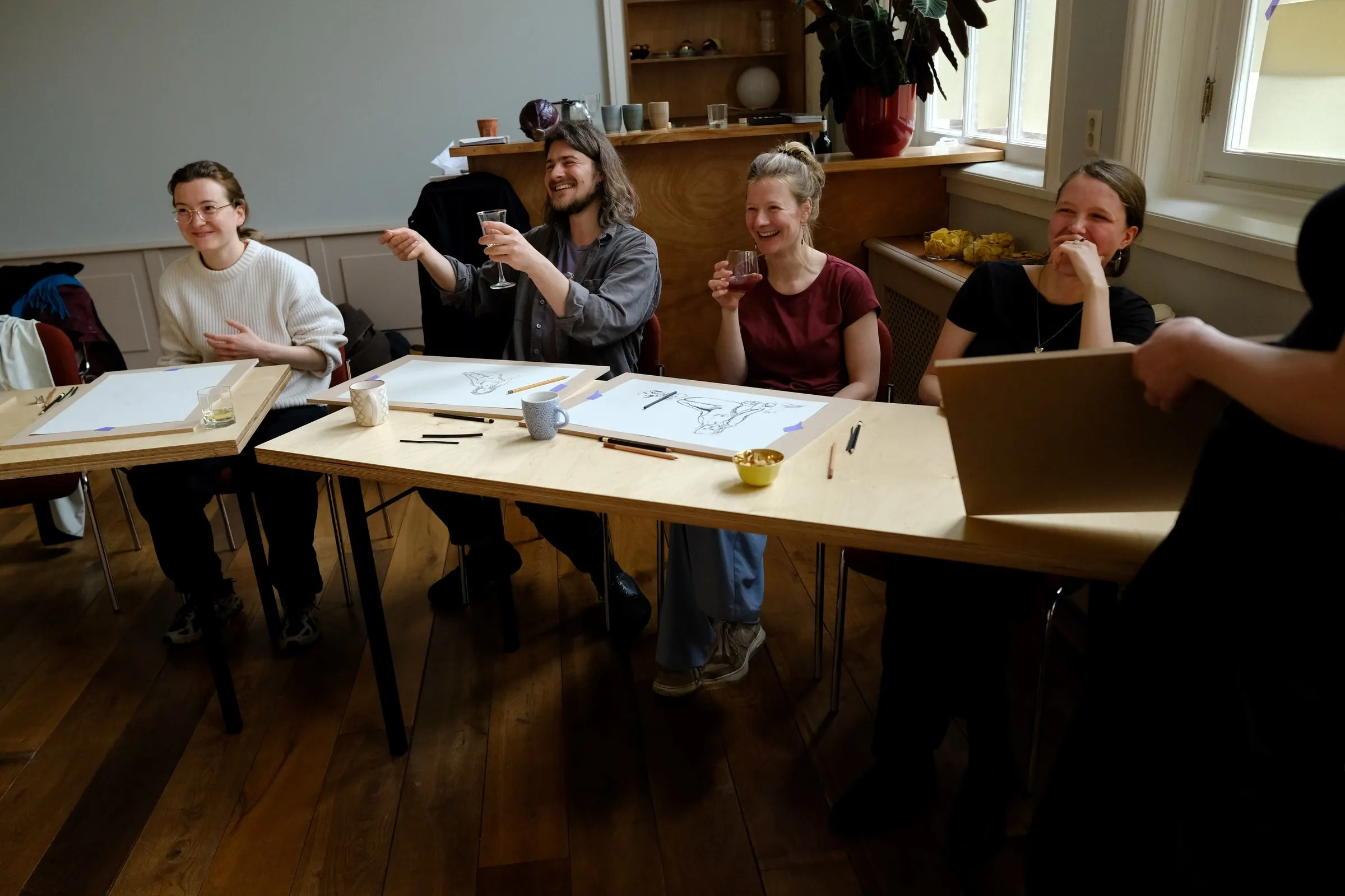A group laughing during a workshop
